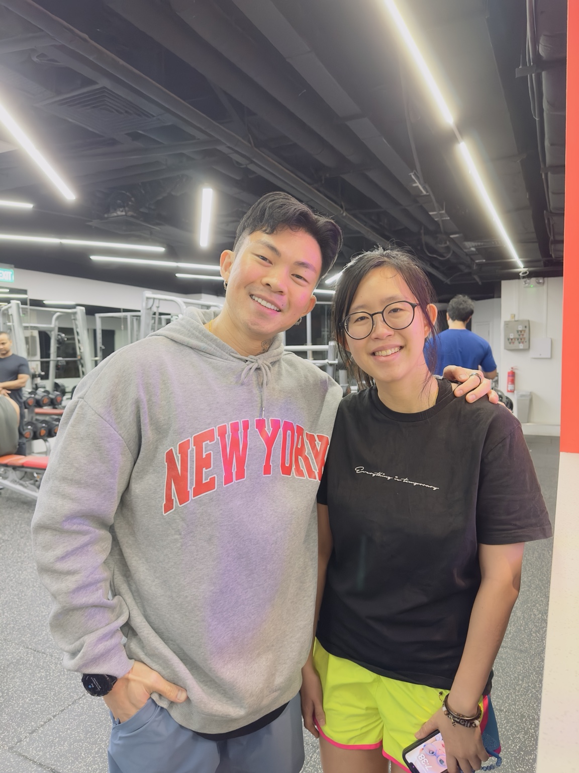 Edison Ho smiling with a client after training